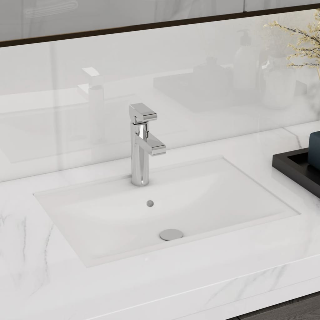 White ceramic rectangular bathroom sink with tap/overflow